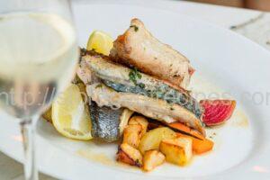 Fish Fillet Baked with Vegetables Under Mayonnaise